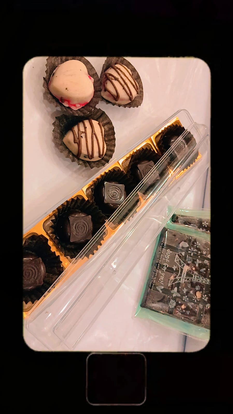 Chocolate containing pieces or a filling of Oreo cookies.