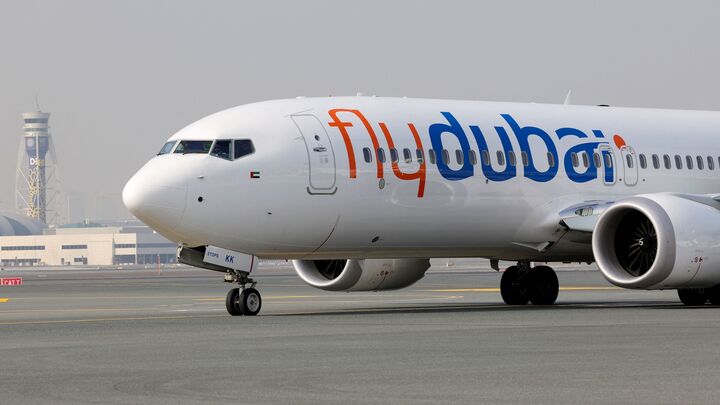 A flydubai Boeing 737 MAX taxis at Dubai International Airport.